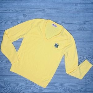 Vintage yellow haymaker sweater with crest emblem no tag around a small / medium